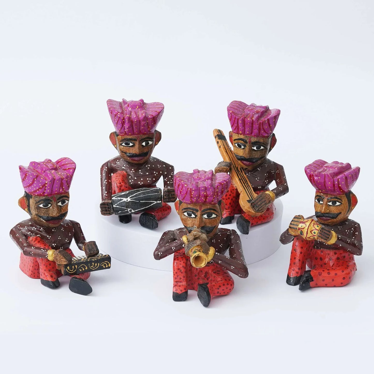 Handcrafted Rajasthani wooden musician figurines set in traditional attire with colorful turbans and musical instruments