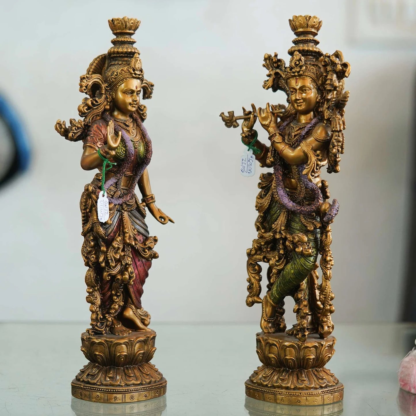 Intricately designed brass Radha-Krishna idol set with antique finish, ideal for home décor, temples, and festive gifting