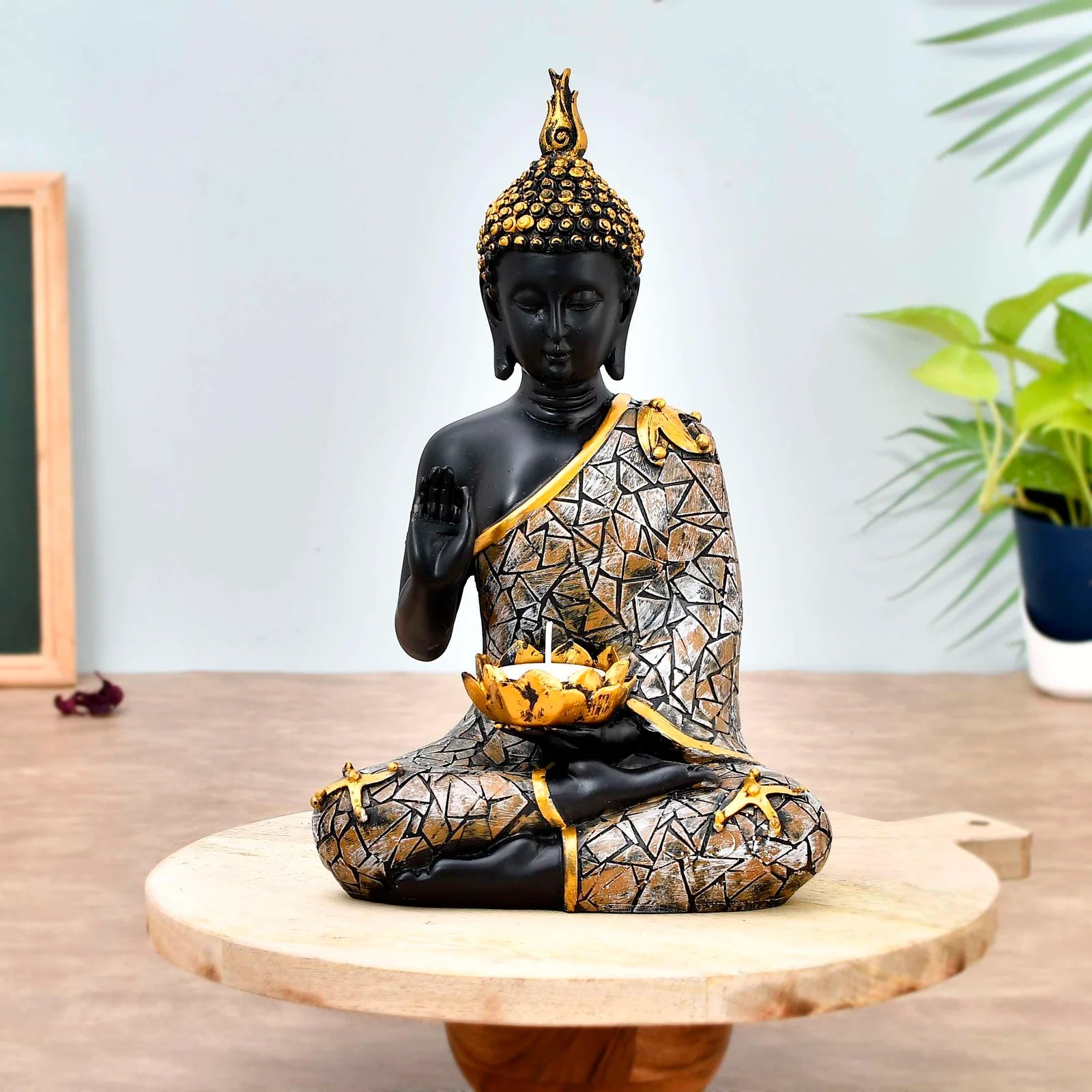 Black and gold resin Buddha statue with mosaic robe and tealight holder in lap