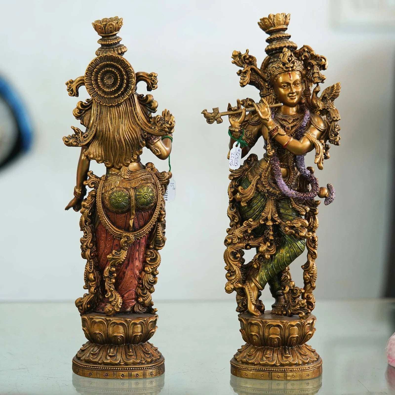 Intricately designed brass Radha-Krishna idol set with antique finish, ideal for home décor, temples, and festive gifting