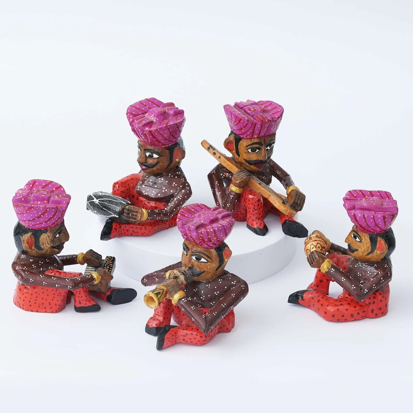 Handcrafted Rajasthani wooden musician figurines set in traditional attire with colorful turbans and musical instruments
