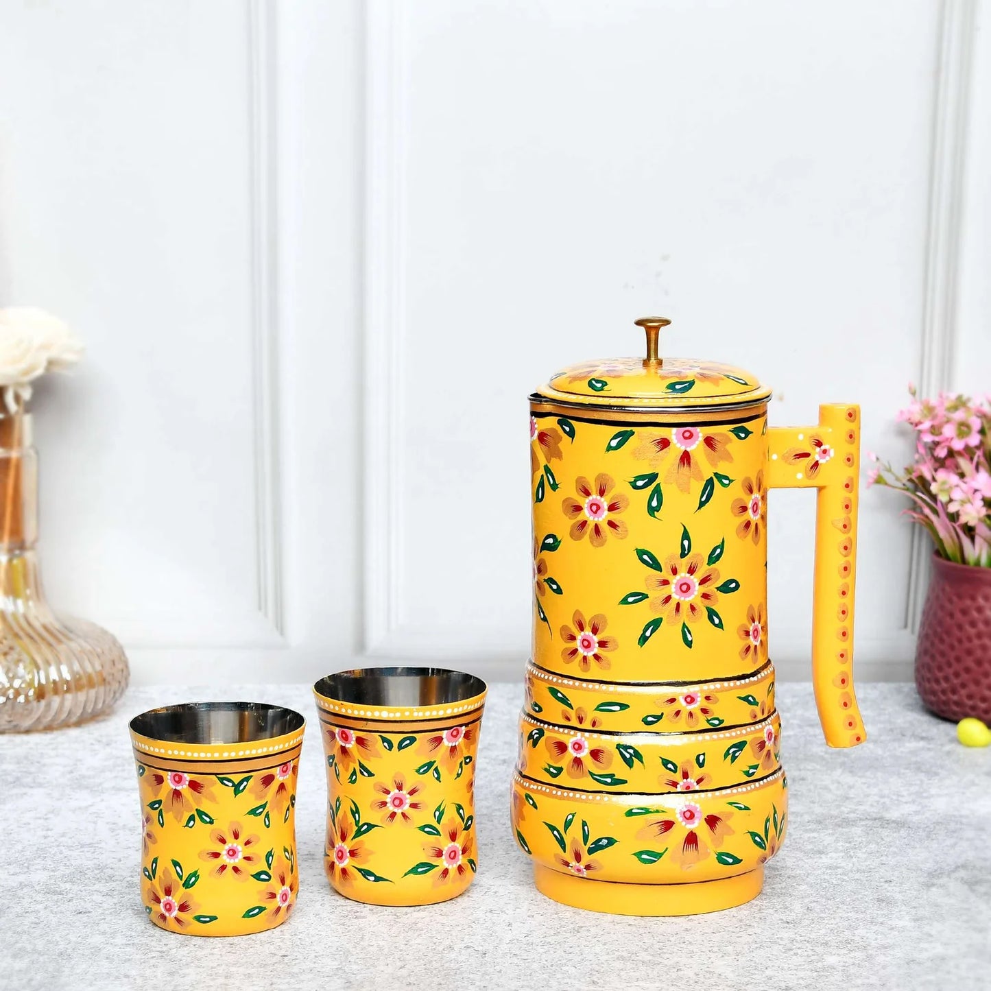Hand-painted stainless steel water jug with floral design and two matching glasses, traditional Indian style