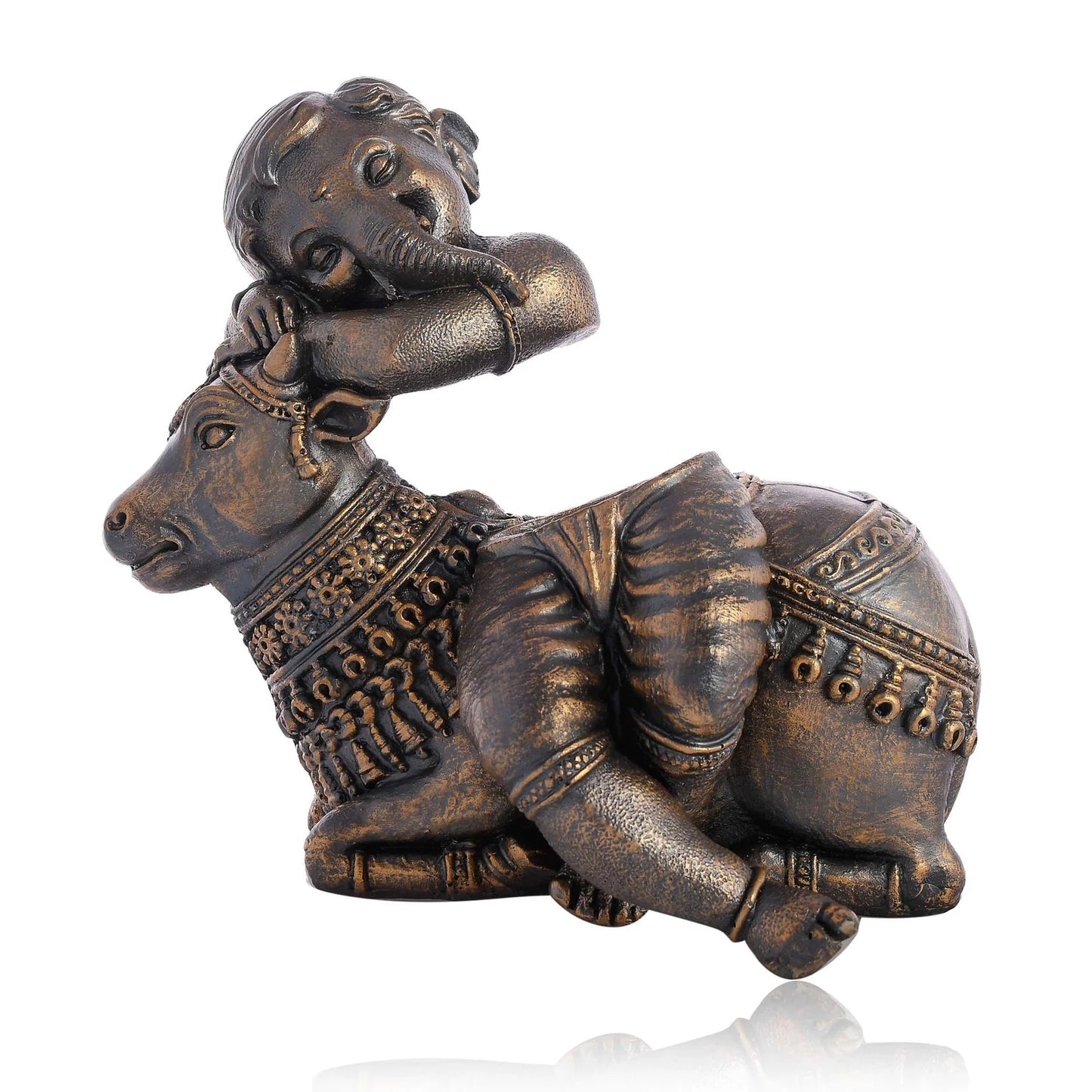 Antique-finish statue of Bal Ganesha resting on a decorated cow, ideal for home décor and gifting