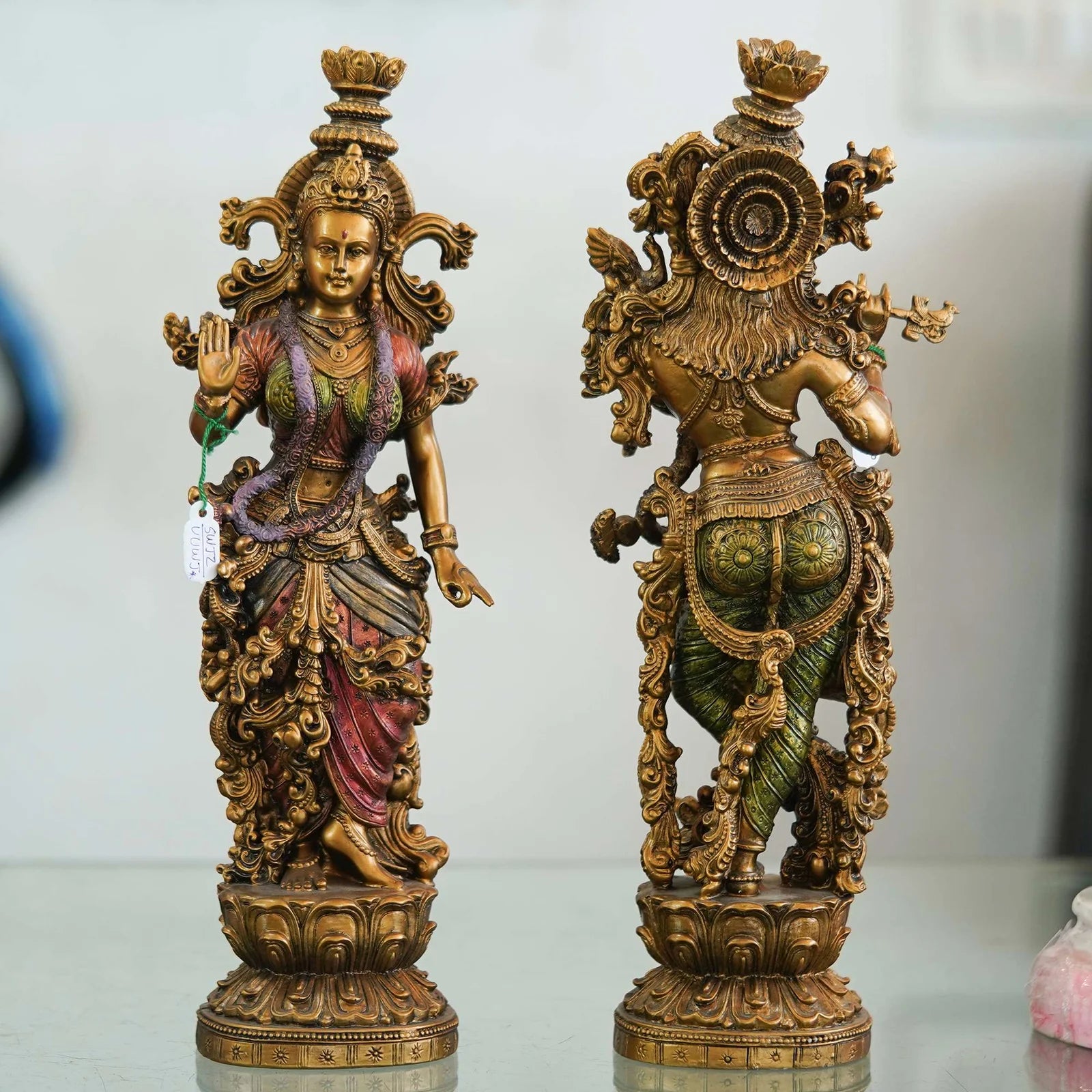 Intricately designed brass Radha-Krishna idol set with antique finish, ideal for home décor, temples, and festive gifting