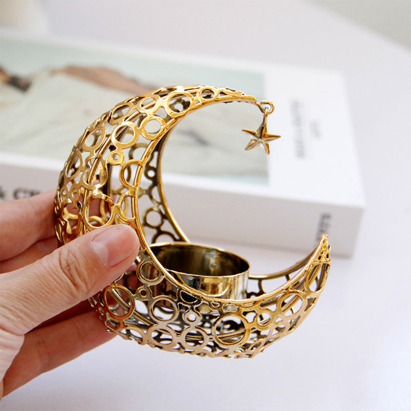 Modern crescent moon candle holder in black and gold metal