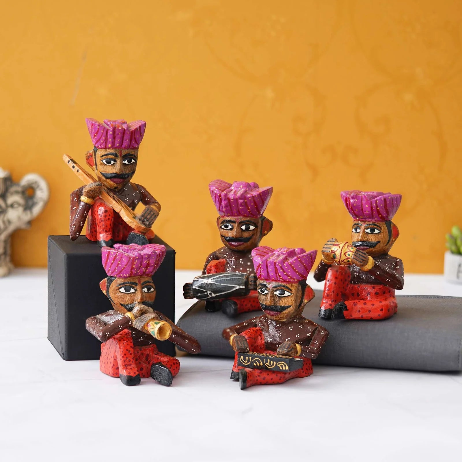 Handcrafted Rajasthani wooden musician figurines set in traditional attire with colorful turbans and musical instruments