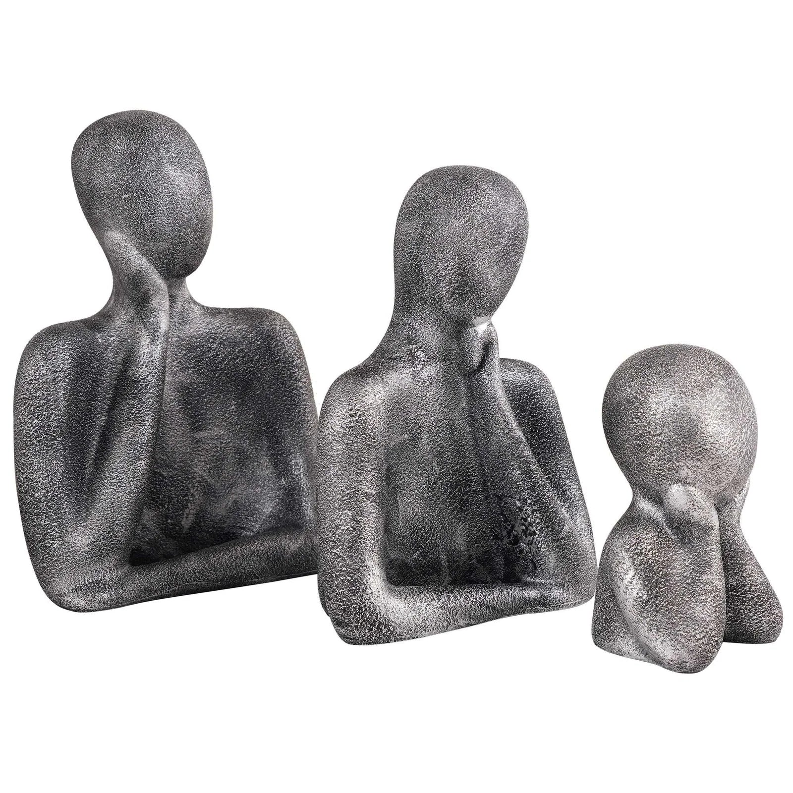 family sculpture set with faceless figures in a thinking pose